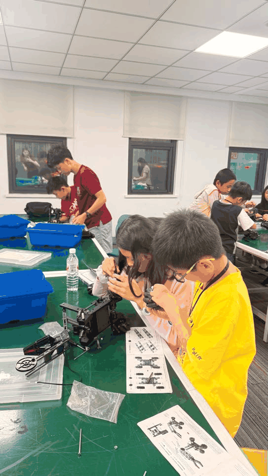 Students building at an activity table