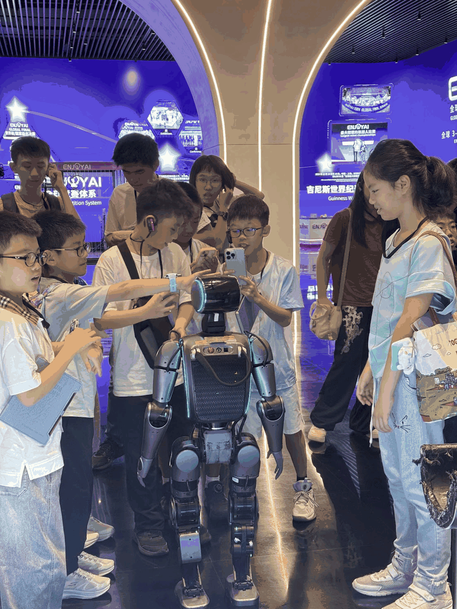 Students interacting with a robot